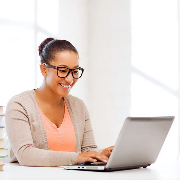 international student girl with laptop at school